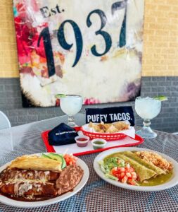 Table with Teka Entrees, Margaritas, and Puffy Tacos
